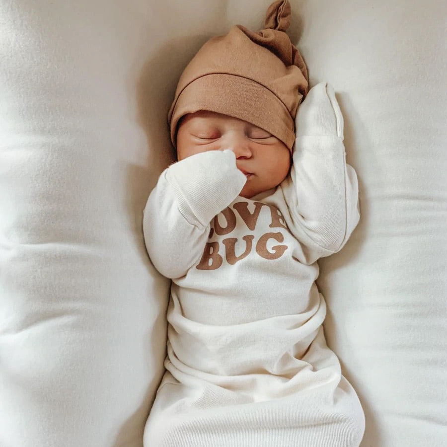 Baby Wearing the Clay Organic Bamboo Baby Top Knot Hat Made in USA