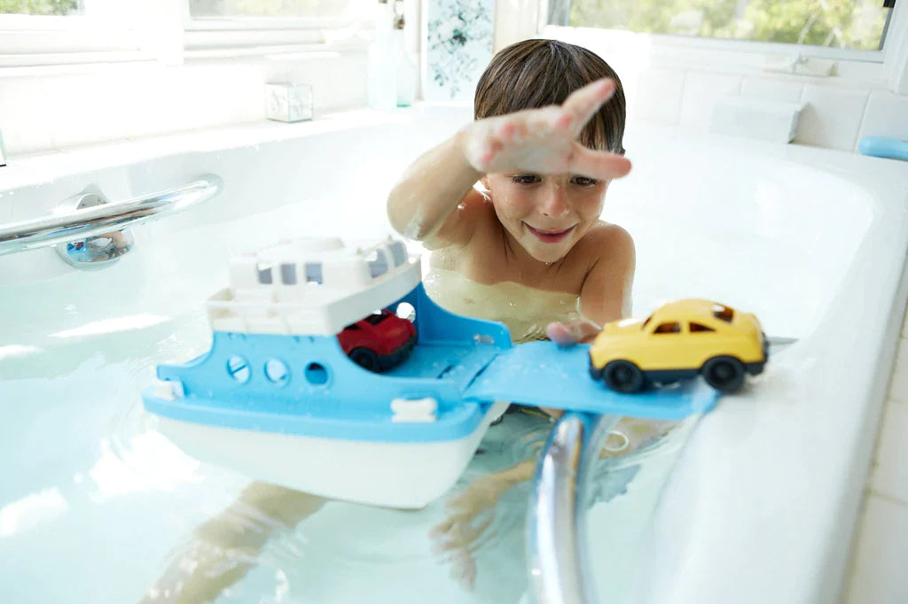 Child Playing with the Ferry Boat in the Bathtub