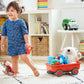 Toddler Pulling Orange Wagon Toy