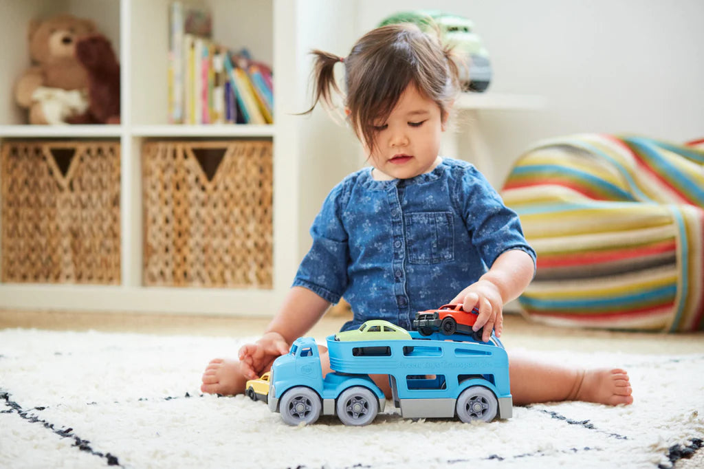 Toddler playing with the car carrier